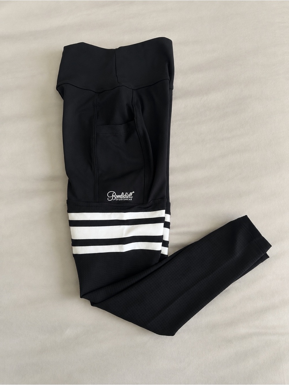 Bombshell Sportswear Woman’s Black Leggings with White Stripe Detail